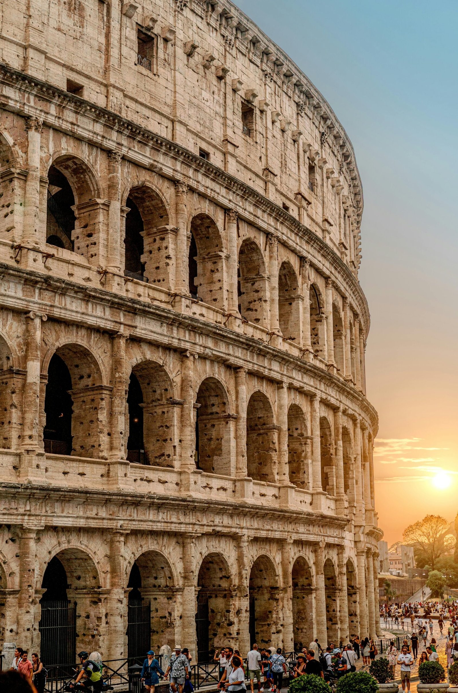 A stunning view of the Roman Colosseum at sunset, capturing the essence of historic Rome.